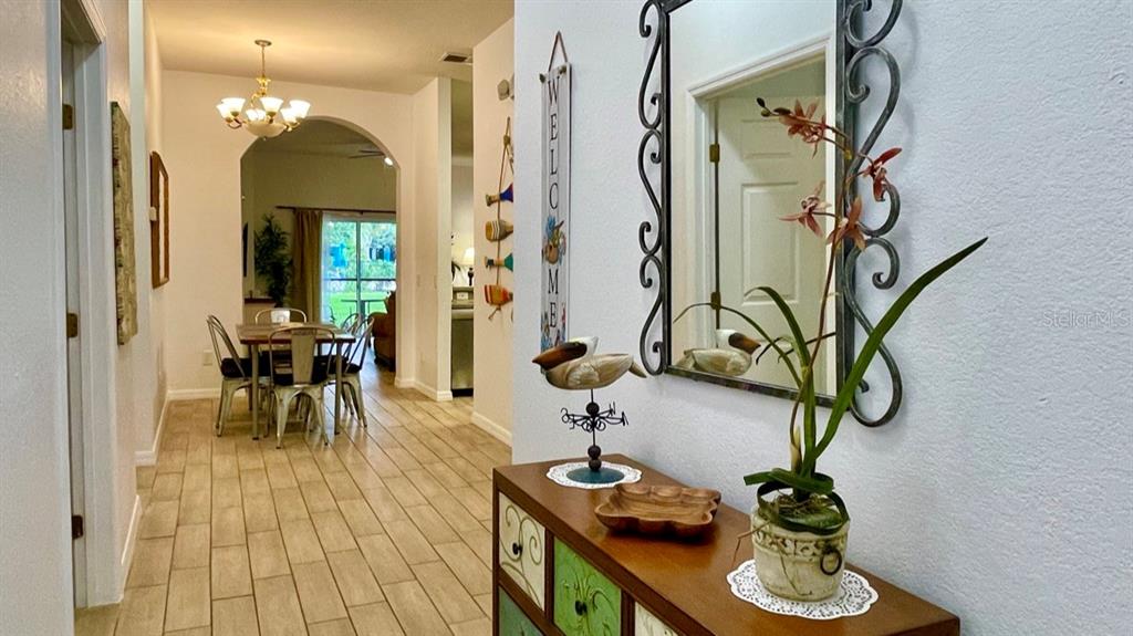 202 Rum Run, Unit 36102 Davenport, FL 33897 - Photo 7 of 21 a view of a dining room with furniture and wooden floor