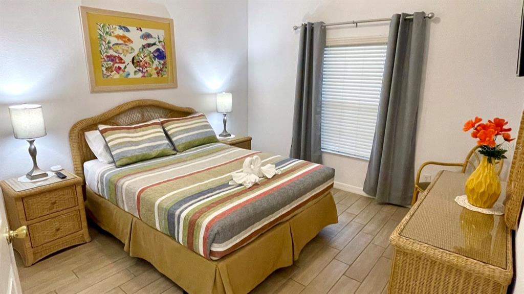 202 Rum Run, Unit 36102 Davenport, FL 33897 - Photo 8 of 21 a bedroom with a bed and a window