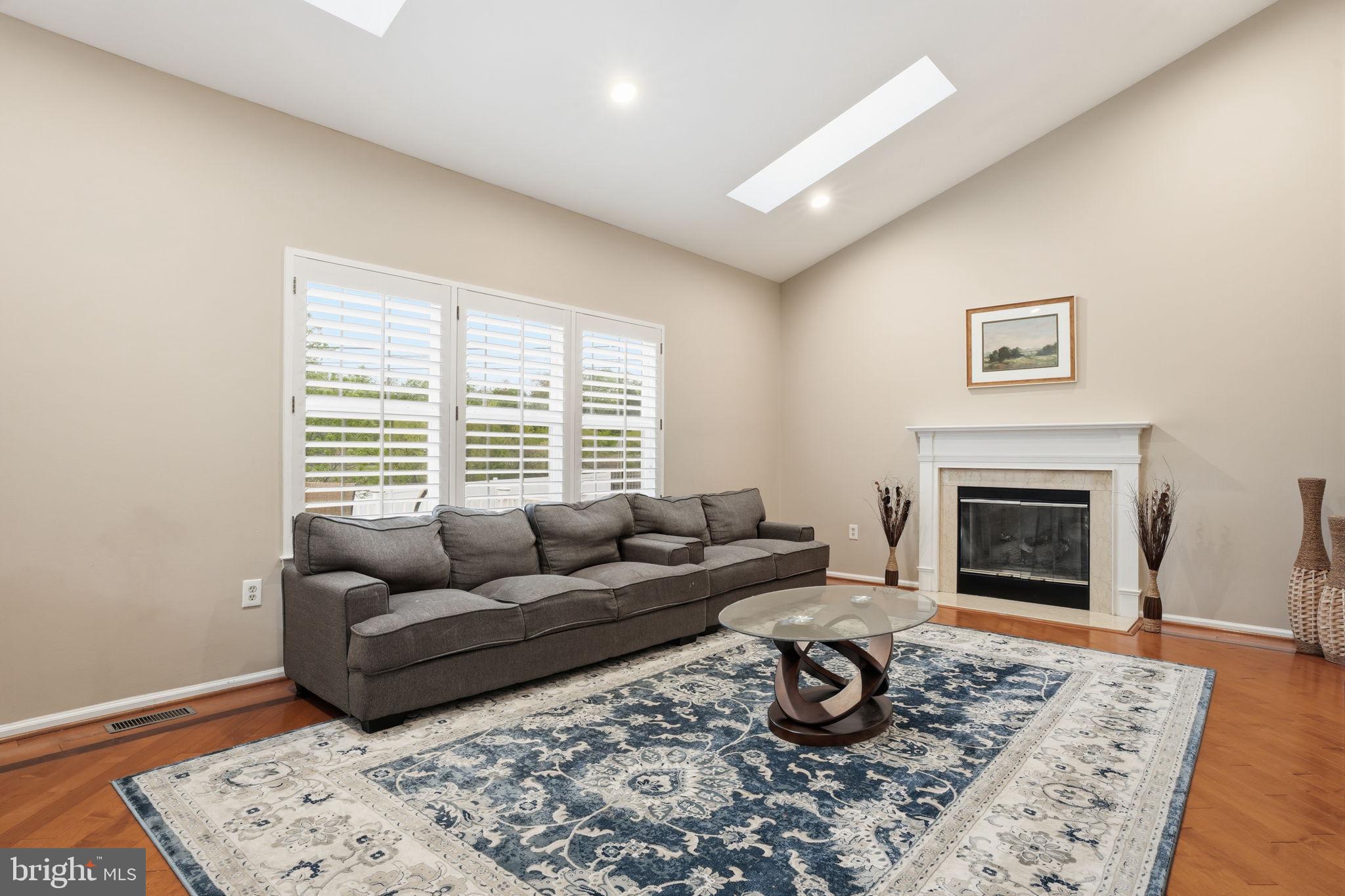 139 Statesman Road Chalfont, PA 18914 - Photo 16 of 64 a living room with furniture and a fireplace