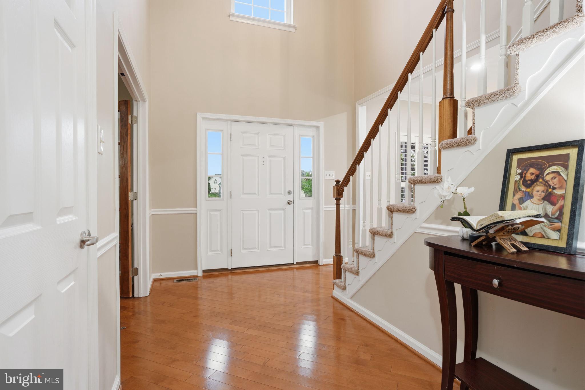 139 Statesman Road Chalfont, PA 18914 - Photo 21 of 64 a view of an entryway with wooden floor and stairs