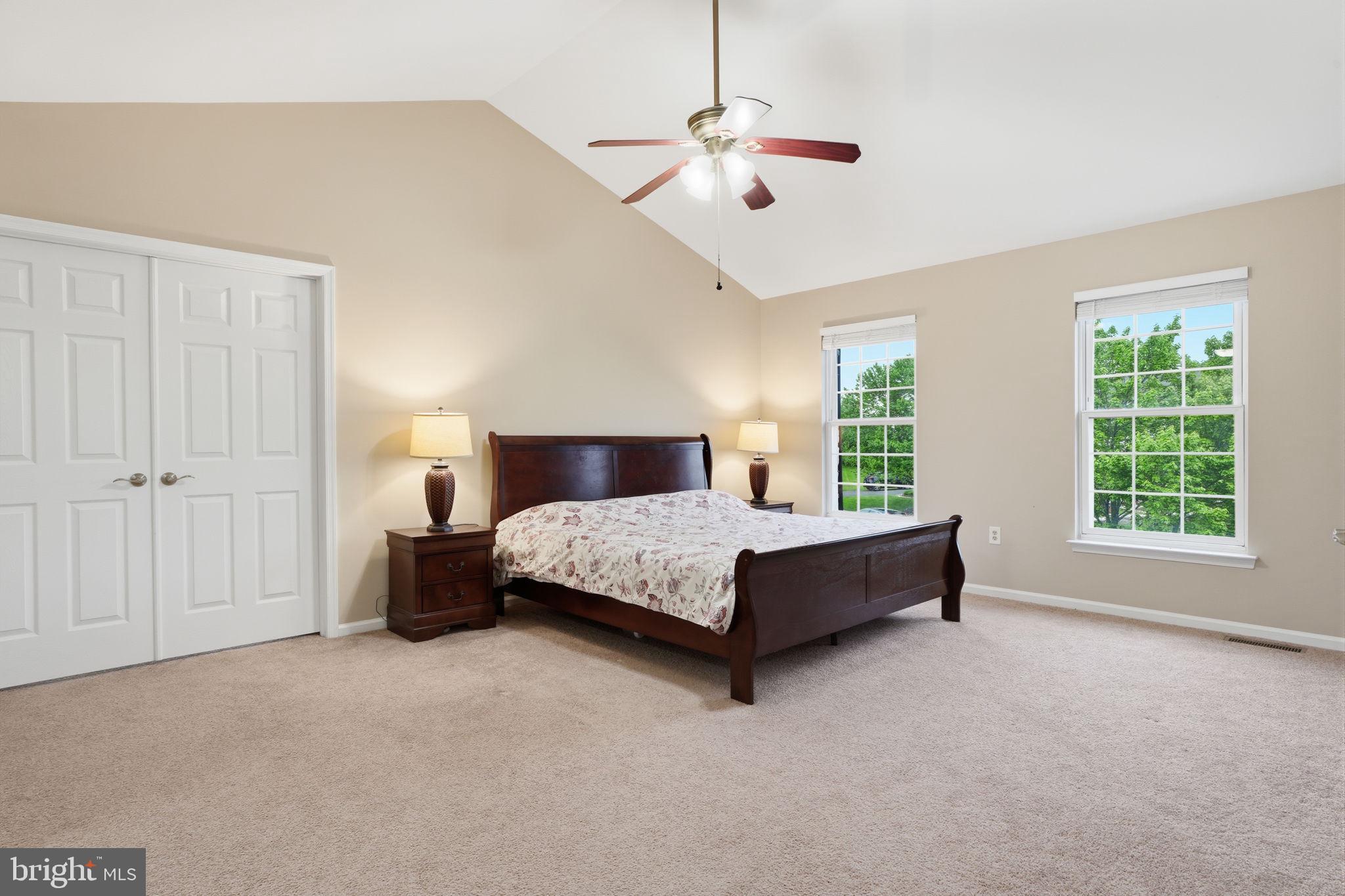 139 Statesman Road Chalfont, PA 18914 - Photo 23 of 64 a bedroom with a large bed and a chandelier