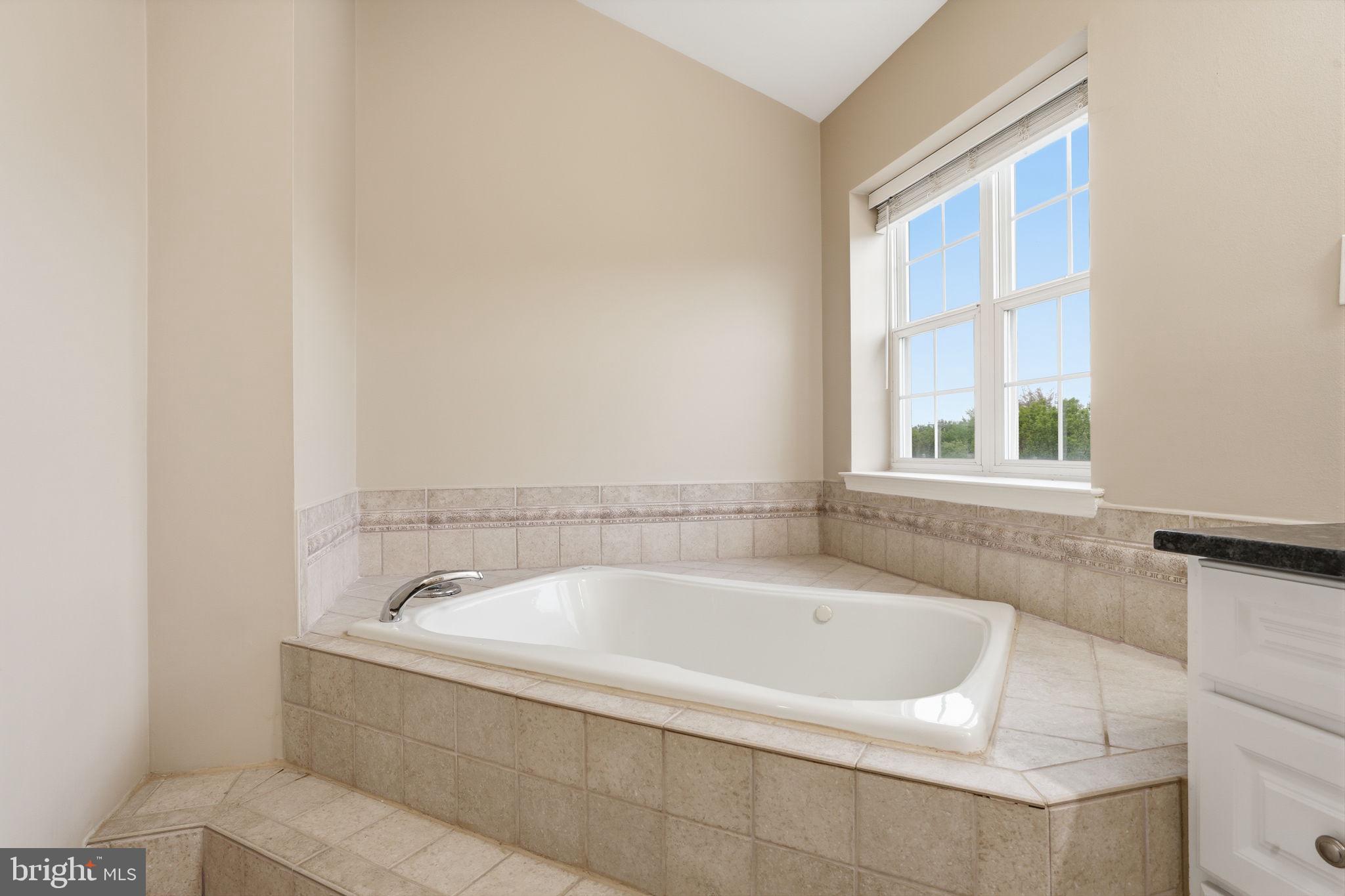 139 Statesman Road Chalfont, PA 18914 - Photo 25 of 64 a white bath tub sitting next to a window