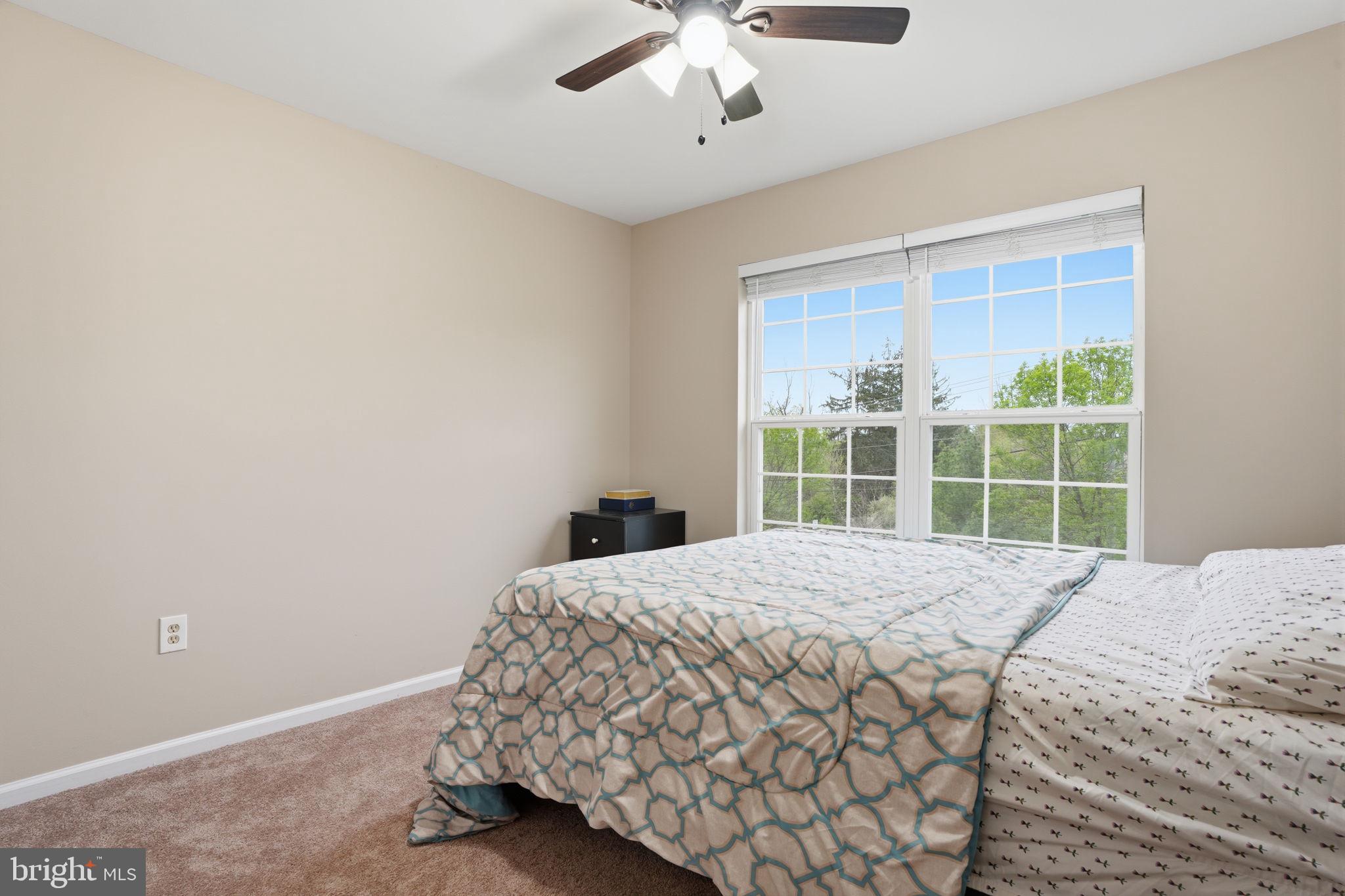 139 Statesman Road Chalfont, PA 18914 - Photo 29 of 64 a bedroom with a large bed and a large window