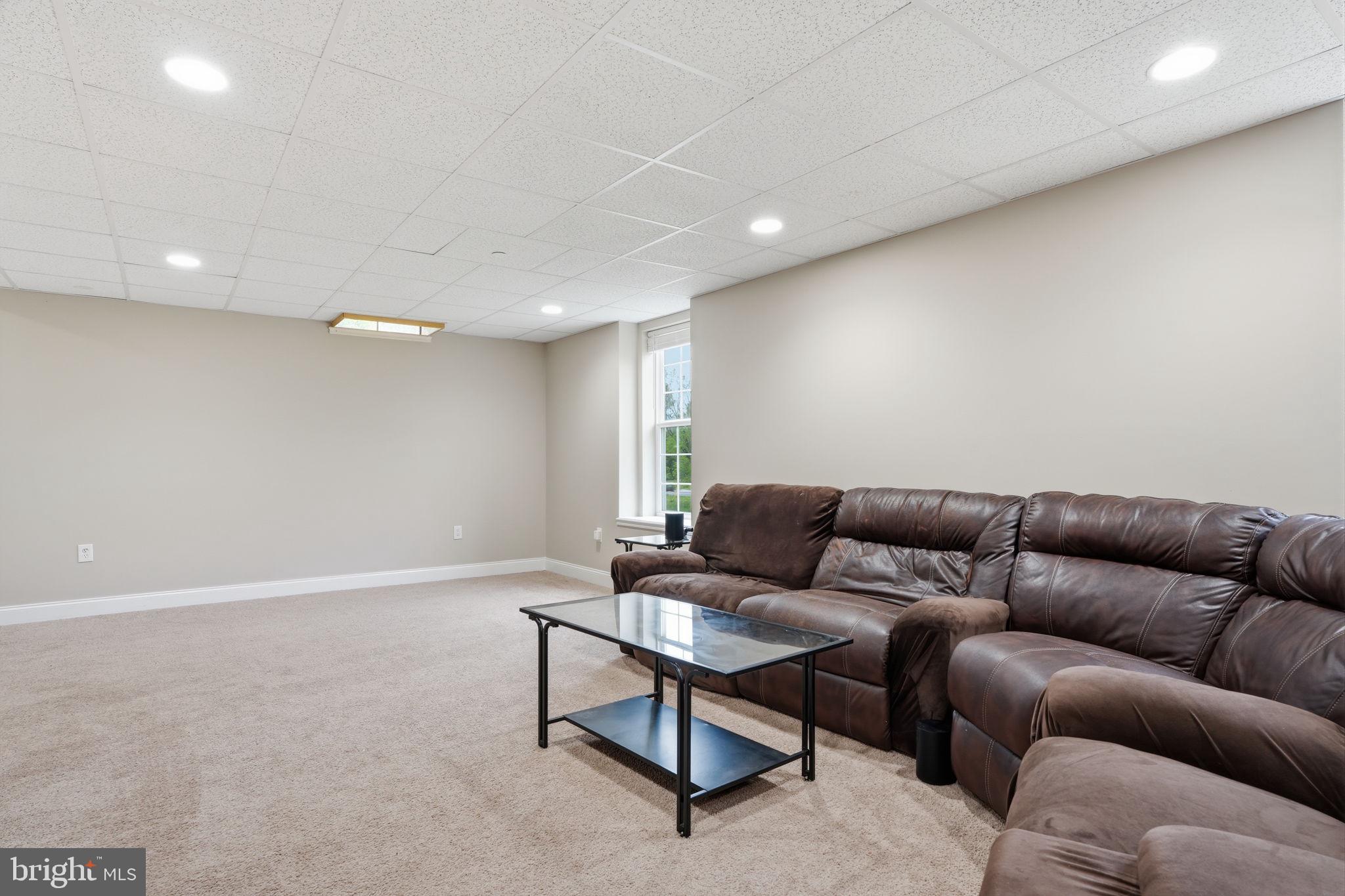 139 Statesman Road Chalfont, PA 18914 - Photo 41 of 64 a living room with furniture and a couch
