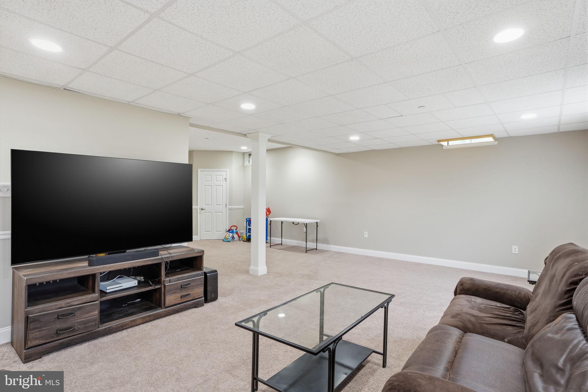 139 Statesman Road Chalfont, PA 18914 - Photo 49 of 64 a living room with furniture and a flat screen tv