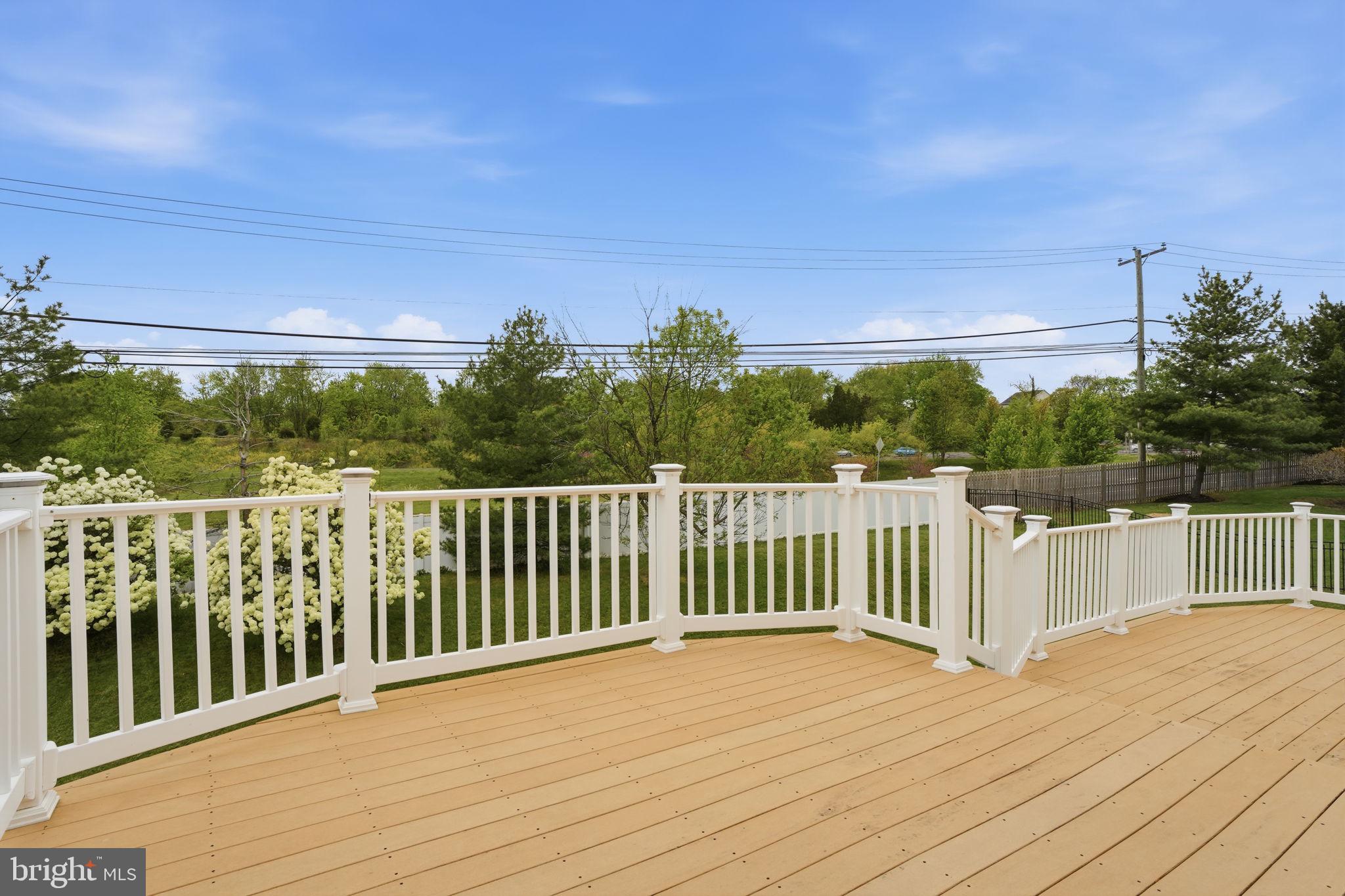 139 Statesman Road Chalfont, PA 18914 - Photo 55 of 64 a view of a balcony with wooden floor and fence
