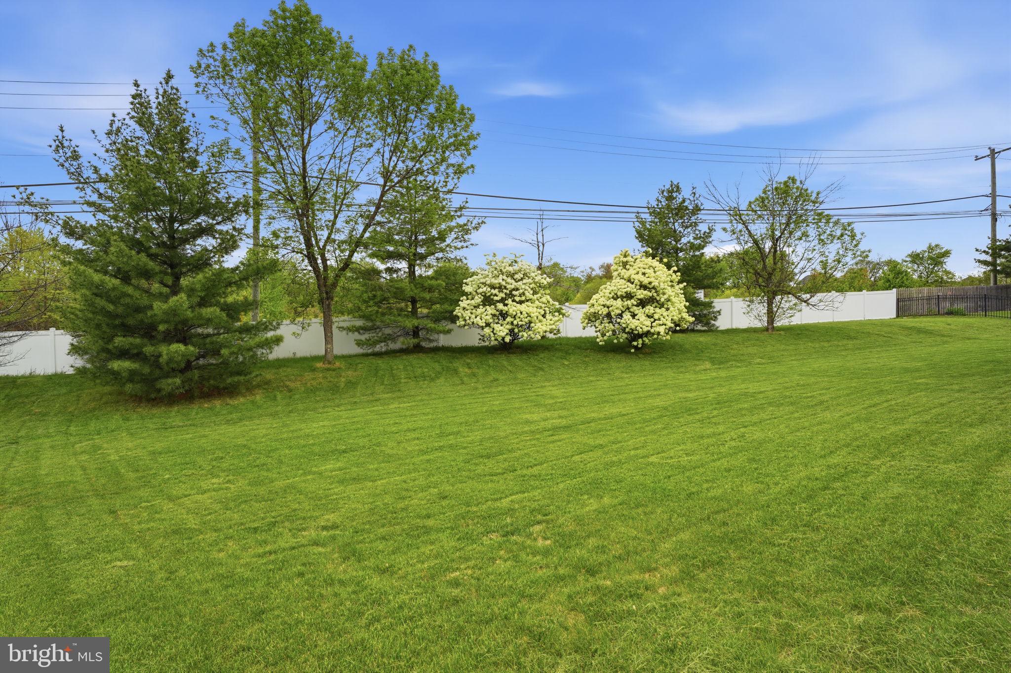 139 Statesman Road Chalfont, PA 18914 - Photo 58 of 64 a view of a garden with a building in the background