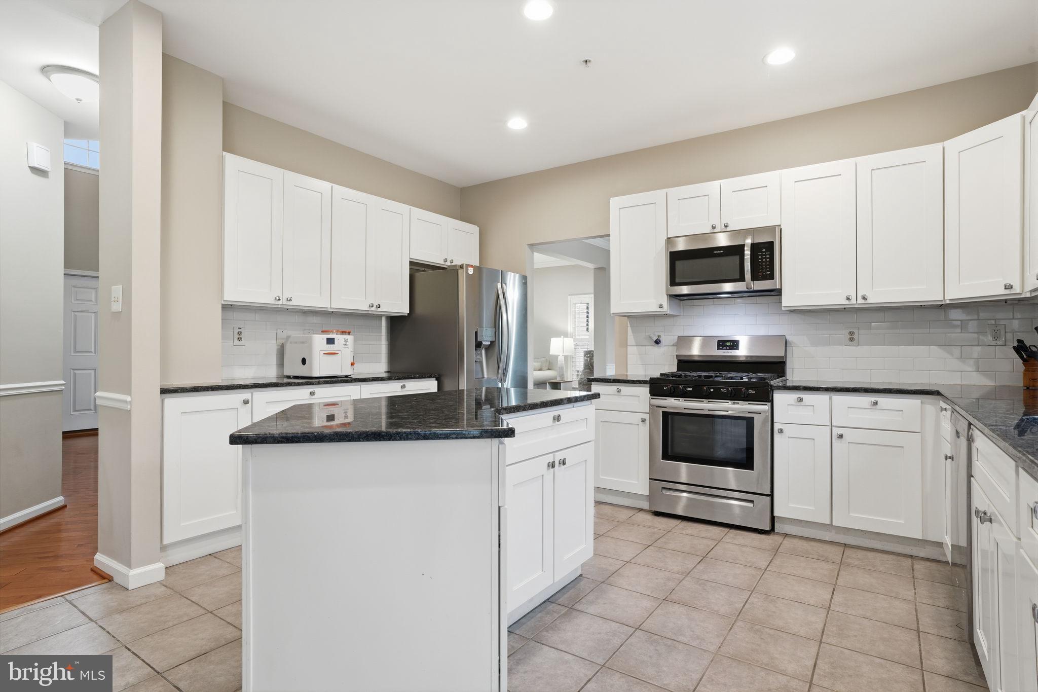 139 Statesman Road Chalfont, PA 18914 - Photo 10 of 64 a kitchen with cabinets stainless steel appliances and a counter top space