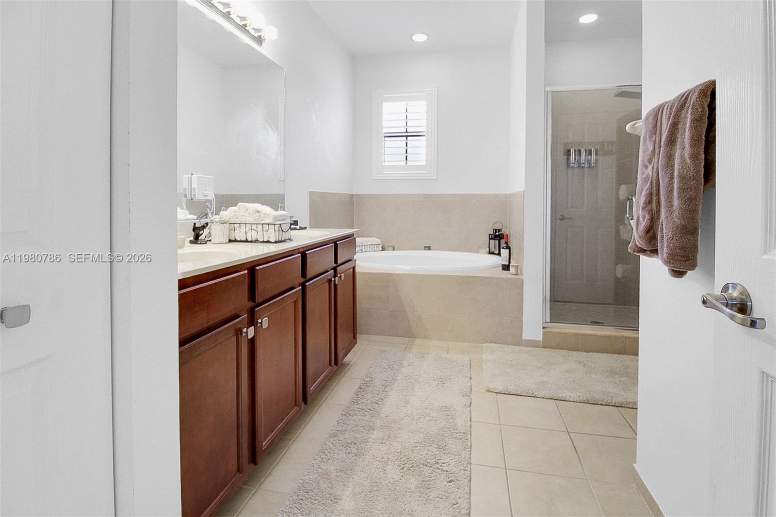 17343 Southwest 155th Court Miami, FL 33187 - Photo 27 of 40 EXTRA LARGE MASTER BATHROOM WITH BATH TUB AND WALK IN SHOWER!