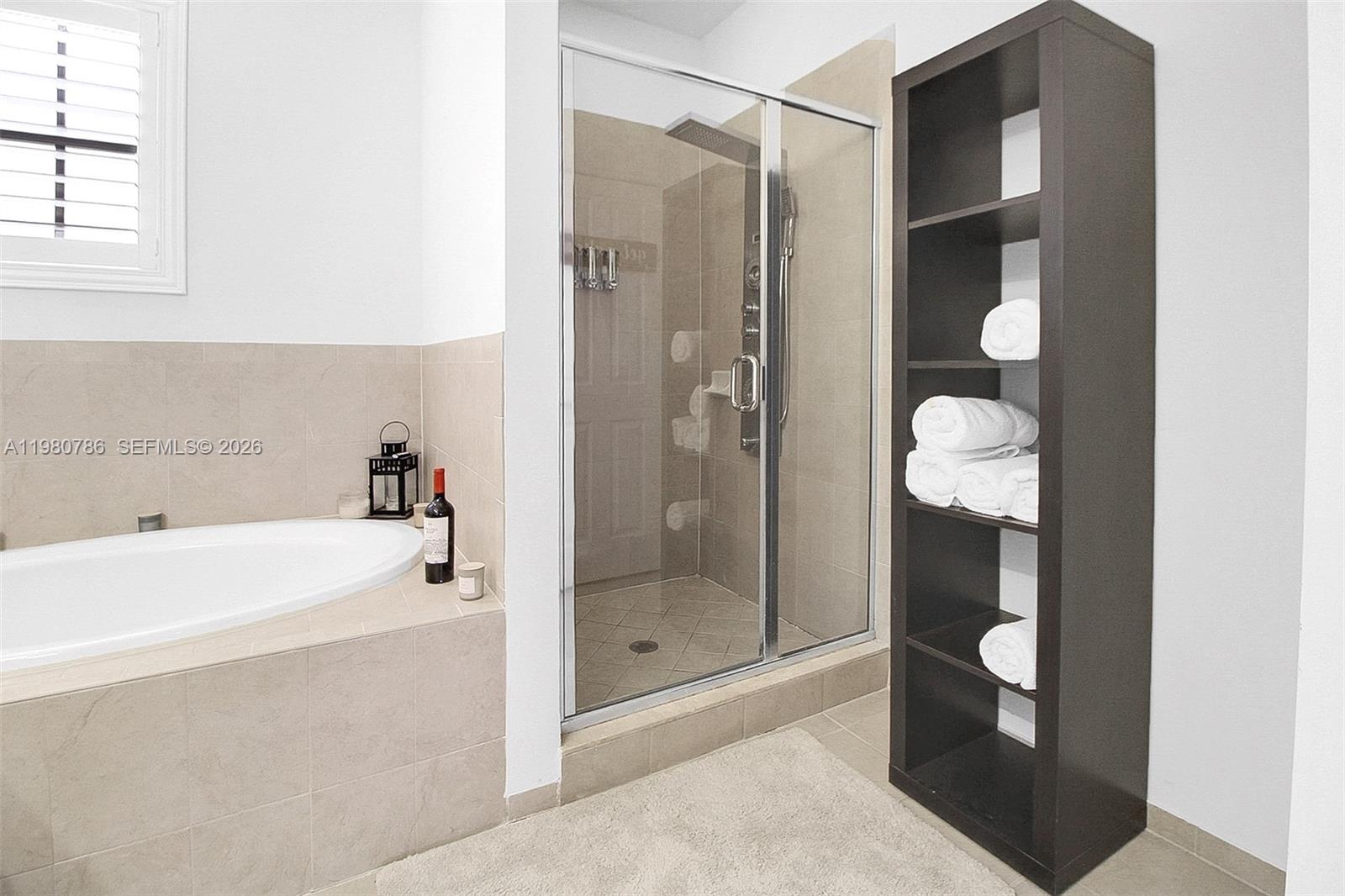 17343 Southwest 155th Court Miami, FL 33187 - Photo 29 of 40 WALK IN SHOWER AND TOWEL SHELVES IN YOUR MASTER BATHROOM!