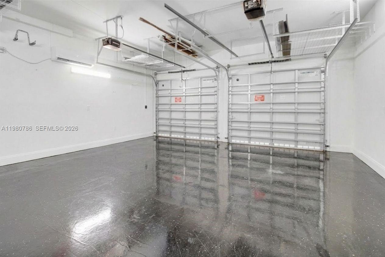 17343 Southwest 155th Court Miami, FL 33187 - Photo 33 of 40 TWO CAR GARAGE AND PLENTY OF ROOM FOR YOUR BIKING, FISHING AND BOATING SUPPLIES!