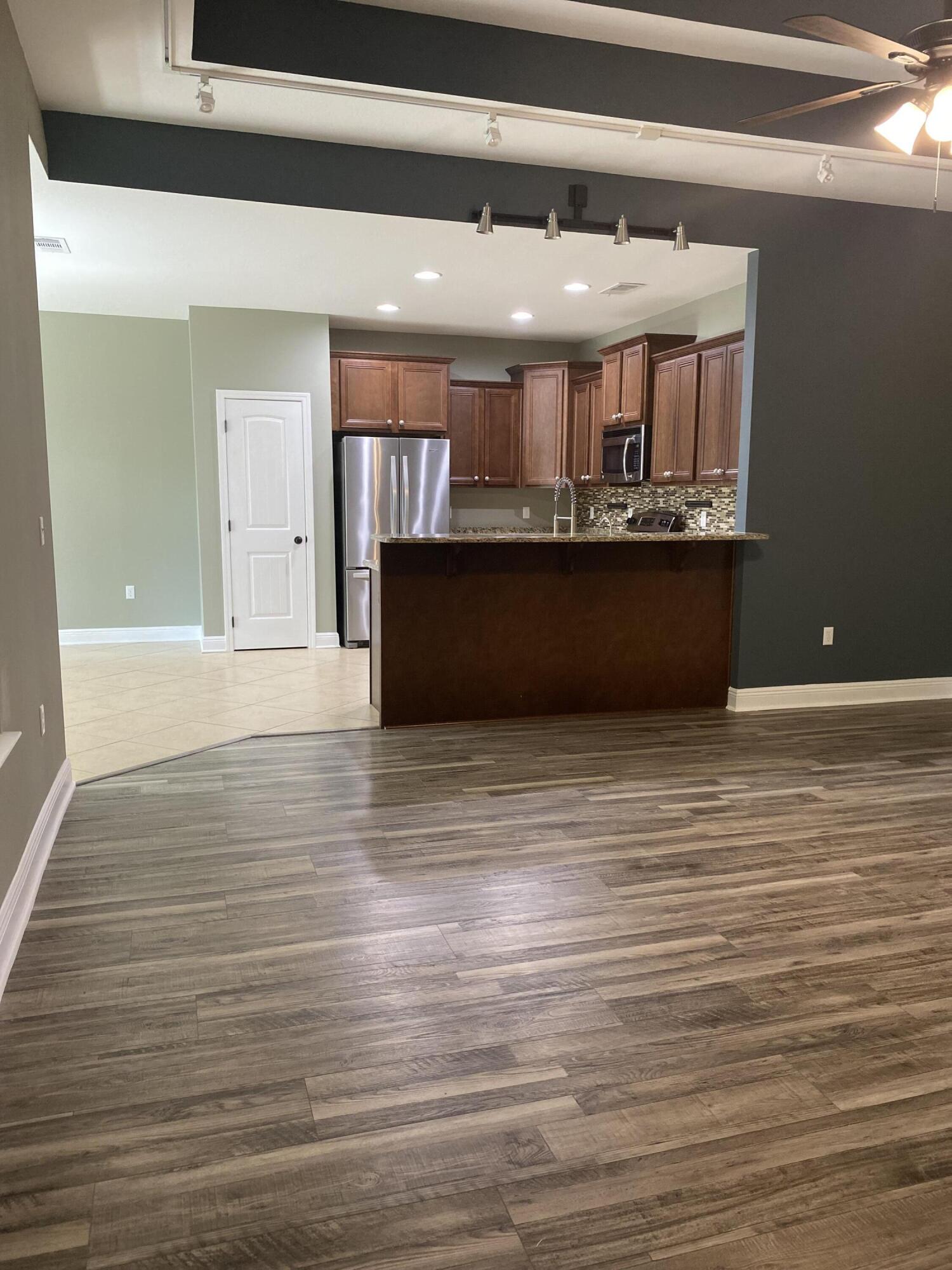 5870 Pescara Drive Pace, FL 32571 - Photo 11 of 31 a view of kitchen and utility room