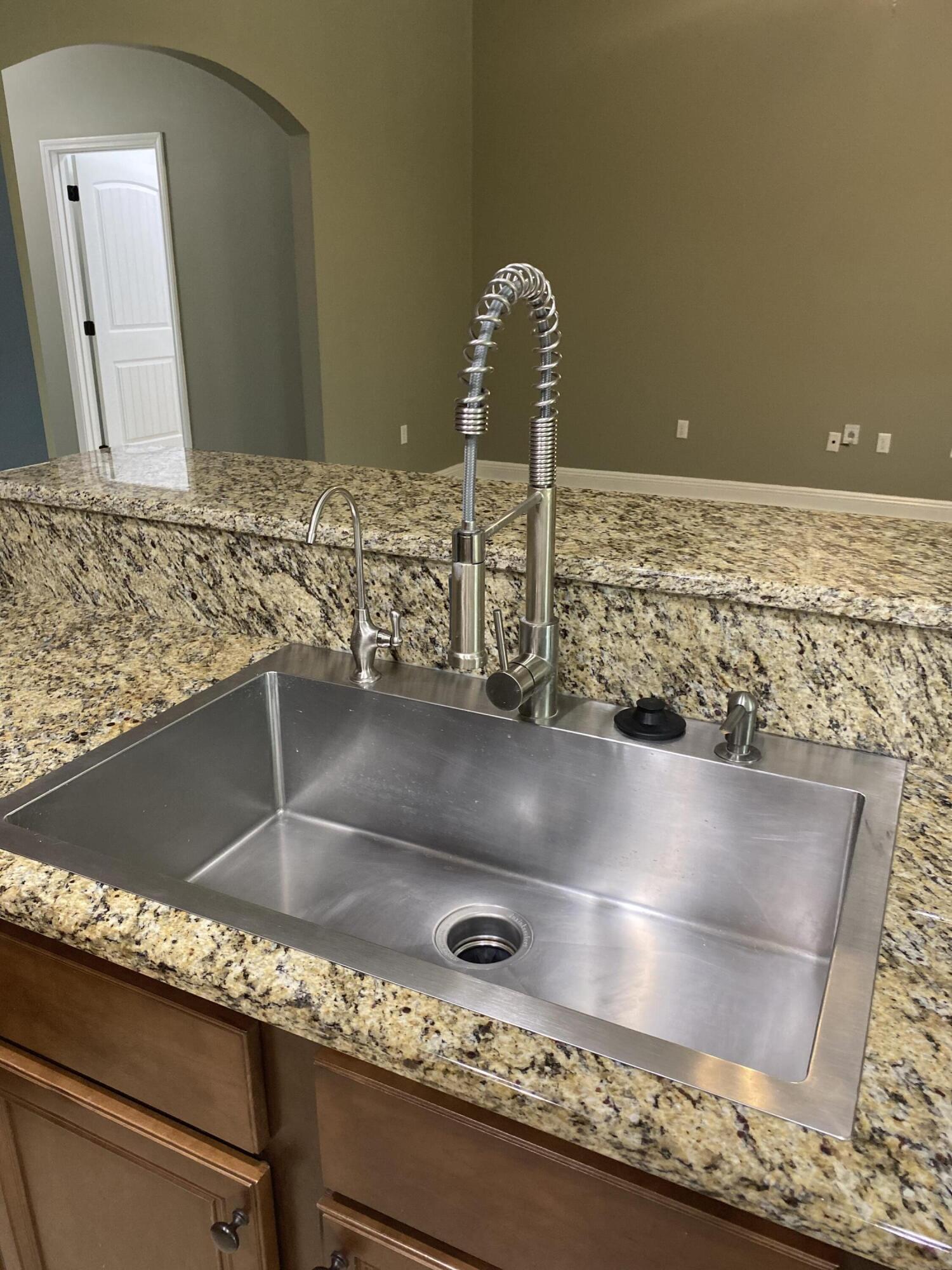 5870 Pescara Drive Pace, FL 32571 - Photo 13 of 31 a close view of sink and tap