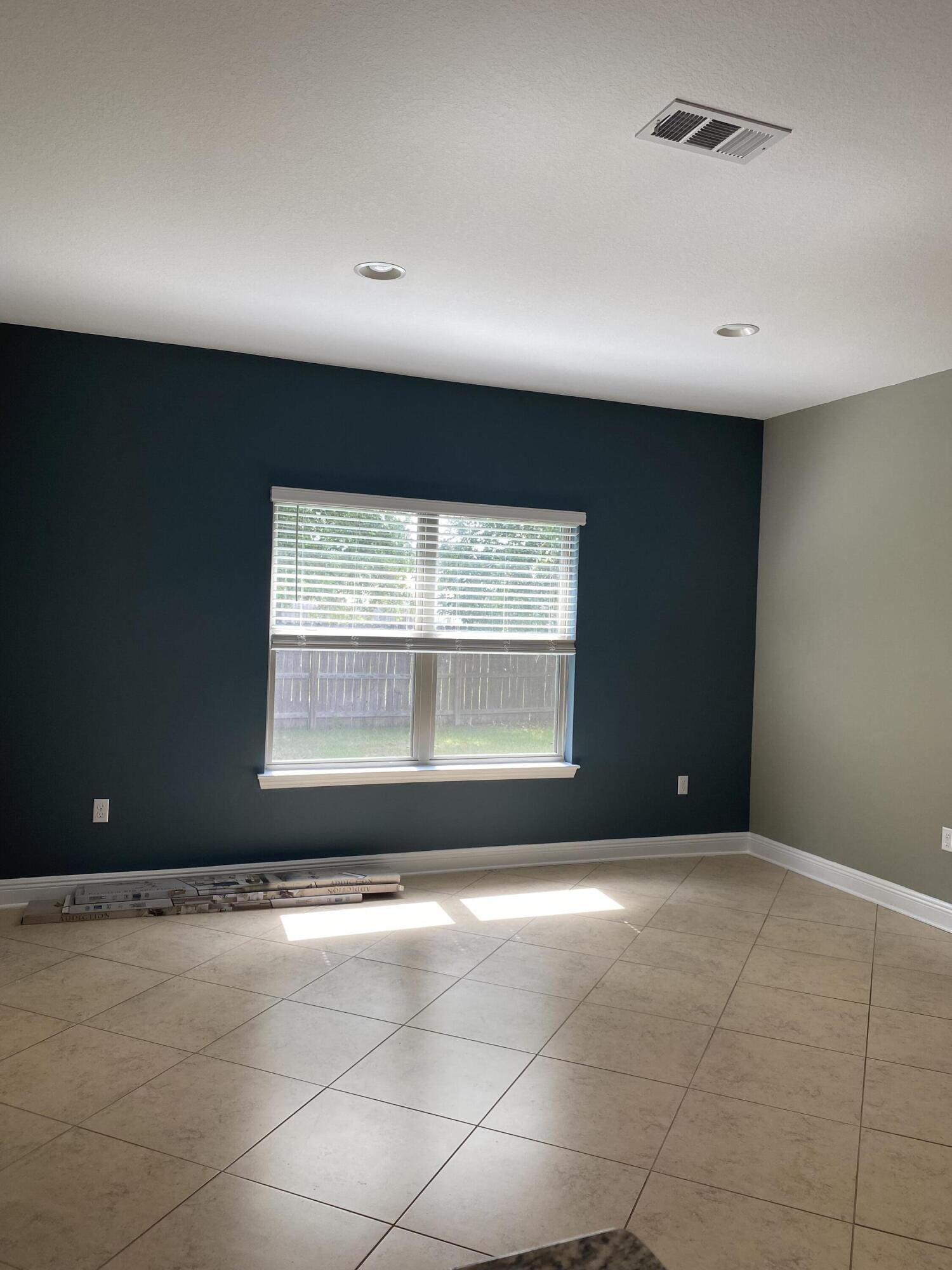 5870 Pescara Drive Pace, FL 32571 - Photo 14 of 31 a view of an empty room with a window