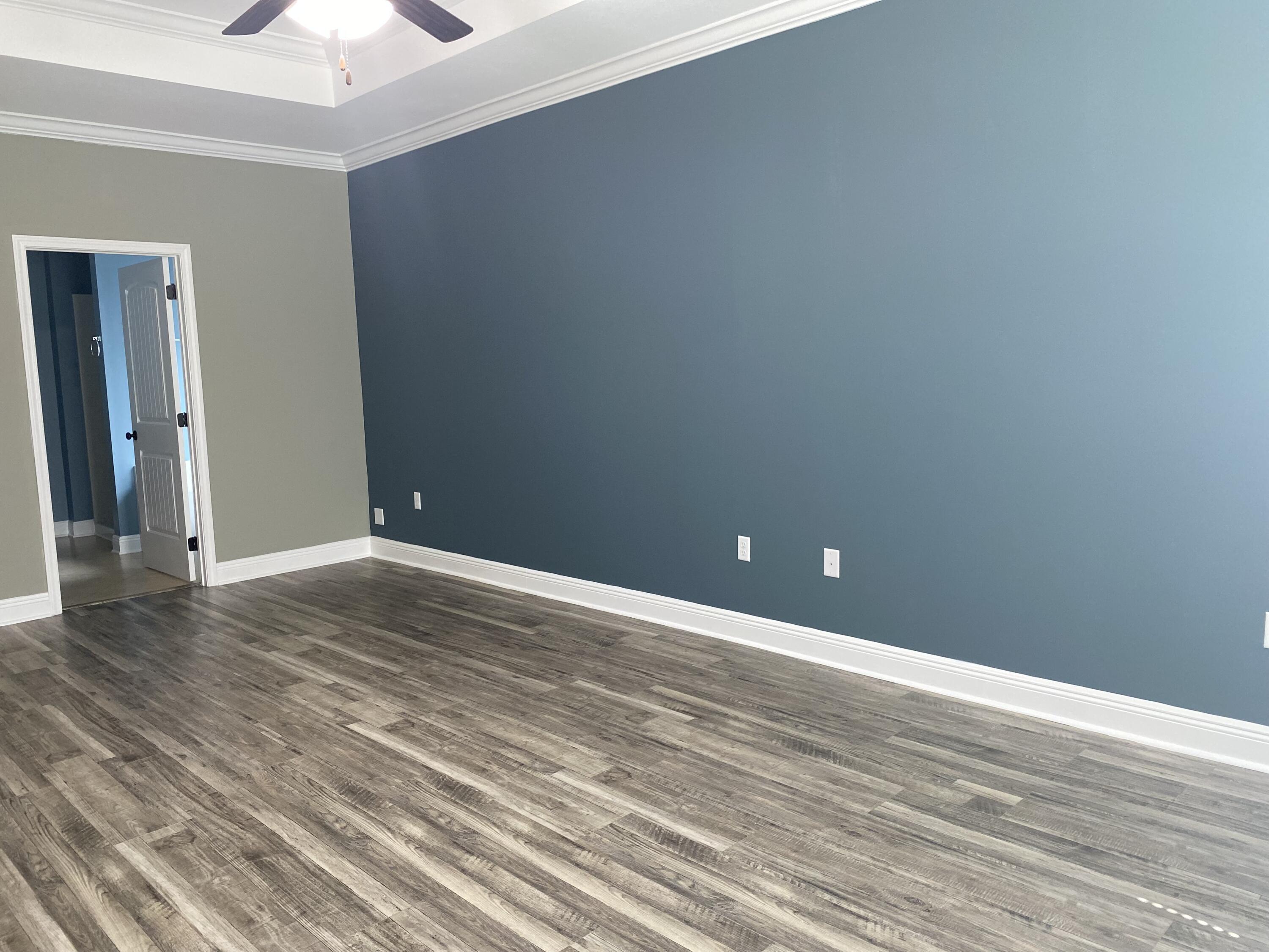 5870 Pescara Drive Pace, FL 32571 - Photo 16 of 31 a view of an empty room and wooden floor