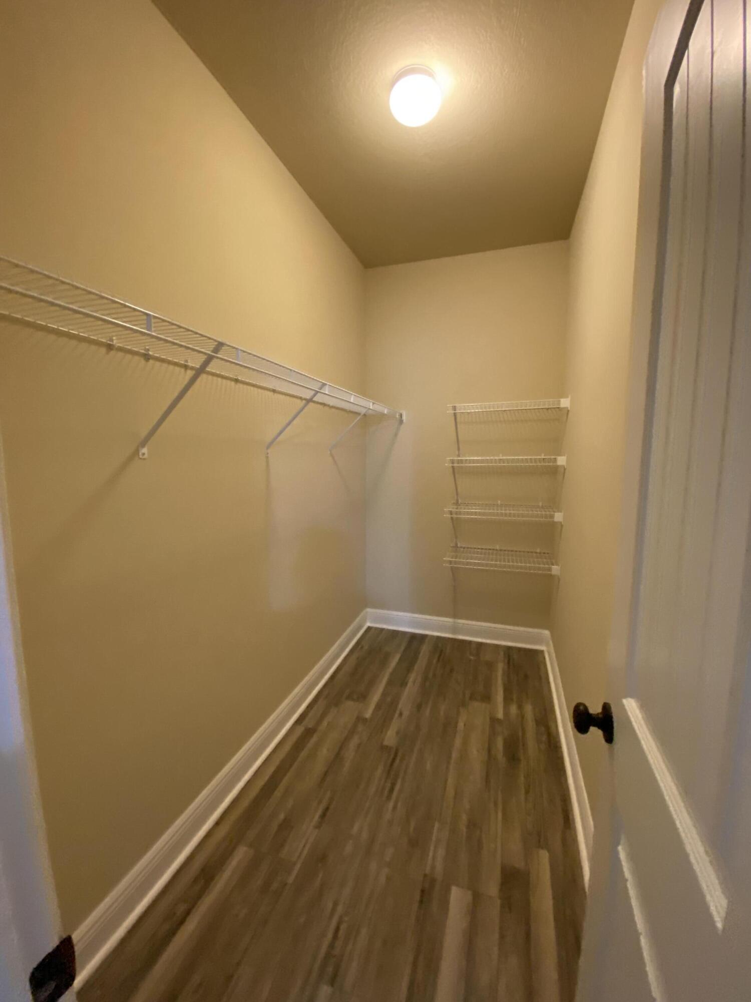 5870 Pescara Drive Pace, FL 32571 - Photo 23 of 31 a view of a room with racks on the wall