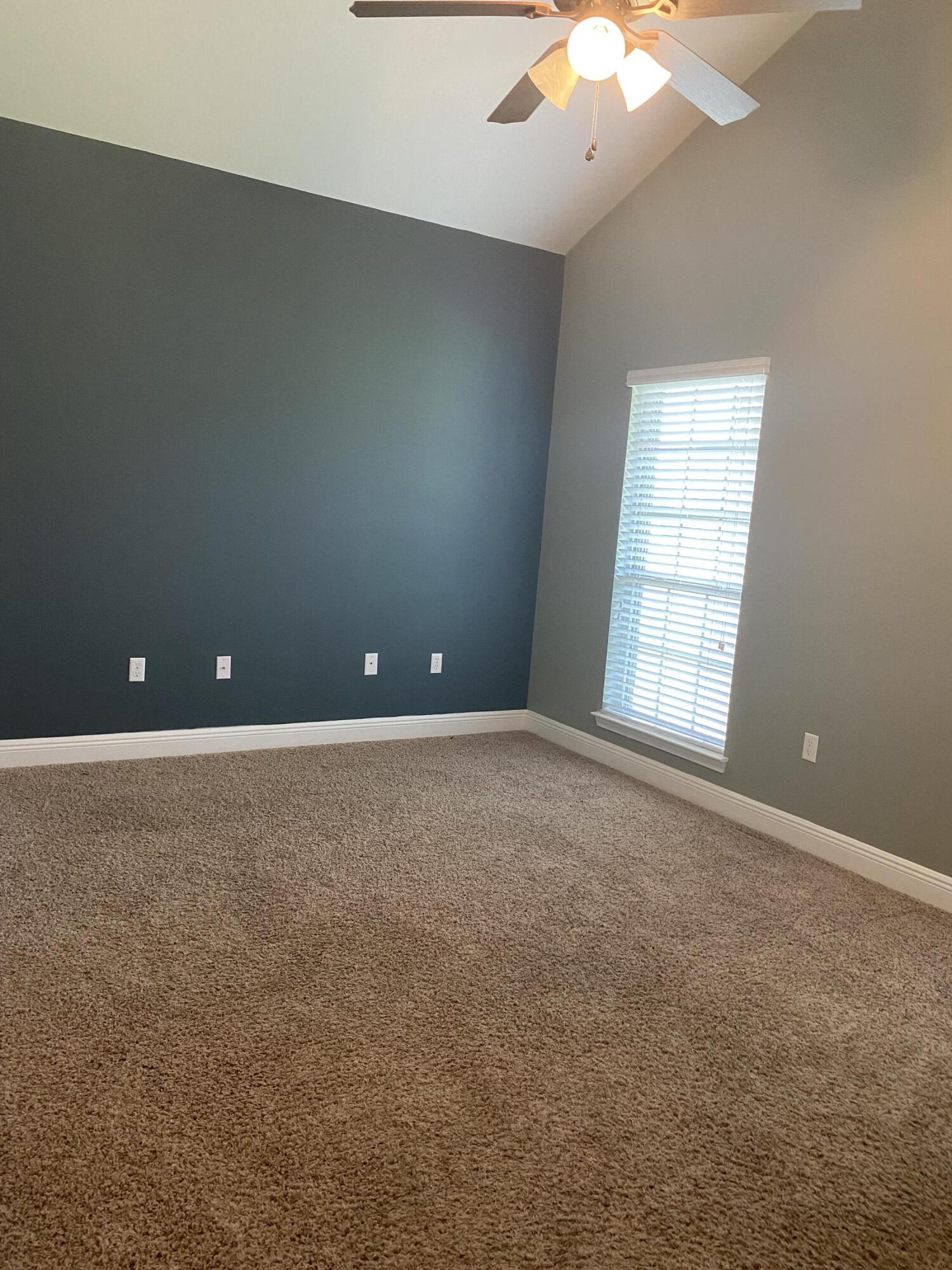 5870 Pescara Drive Pace, FL 32571 - Photo 24 of 31 en empty room with windows and ceiling fan