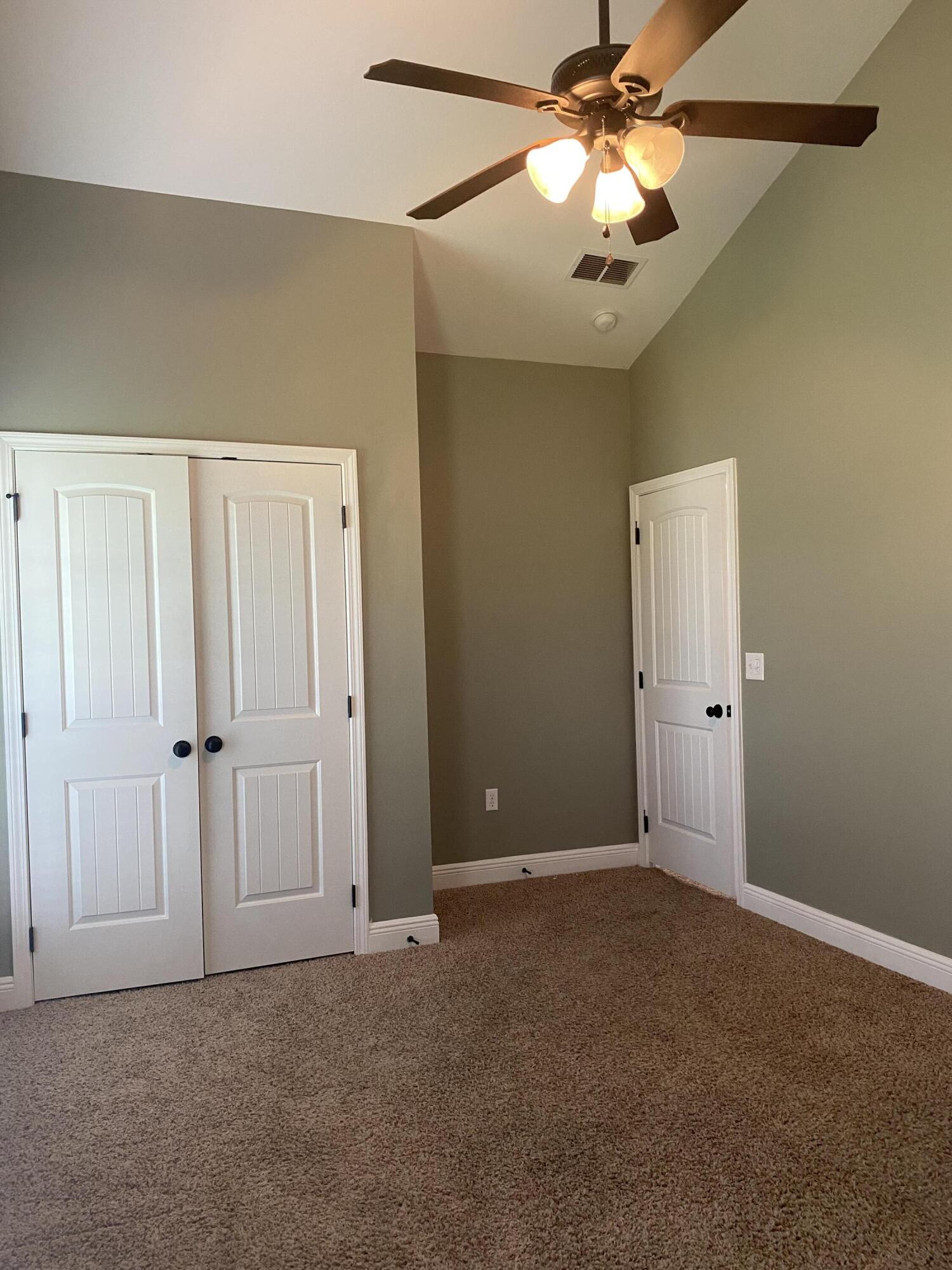 5870 Pescara Drive Pace, FL 32571 - Photo 25 of 31 a view of an empty room and chandelier fan