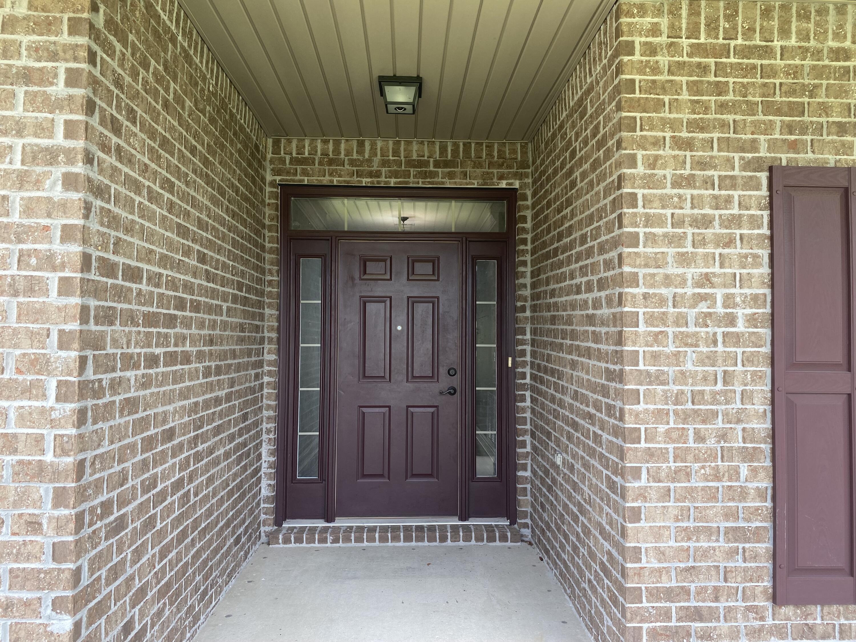 5870 Pescara Drive Pace, FL 32571 - Photo 5 of 31 a view of front door of house