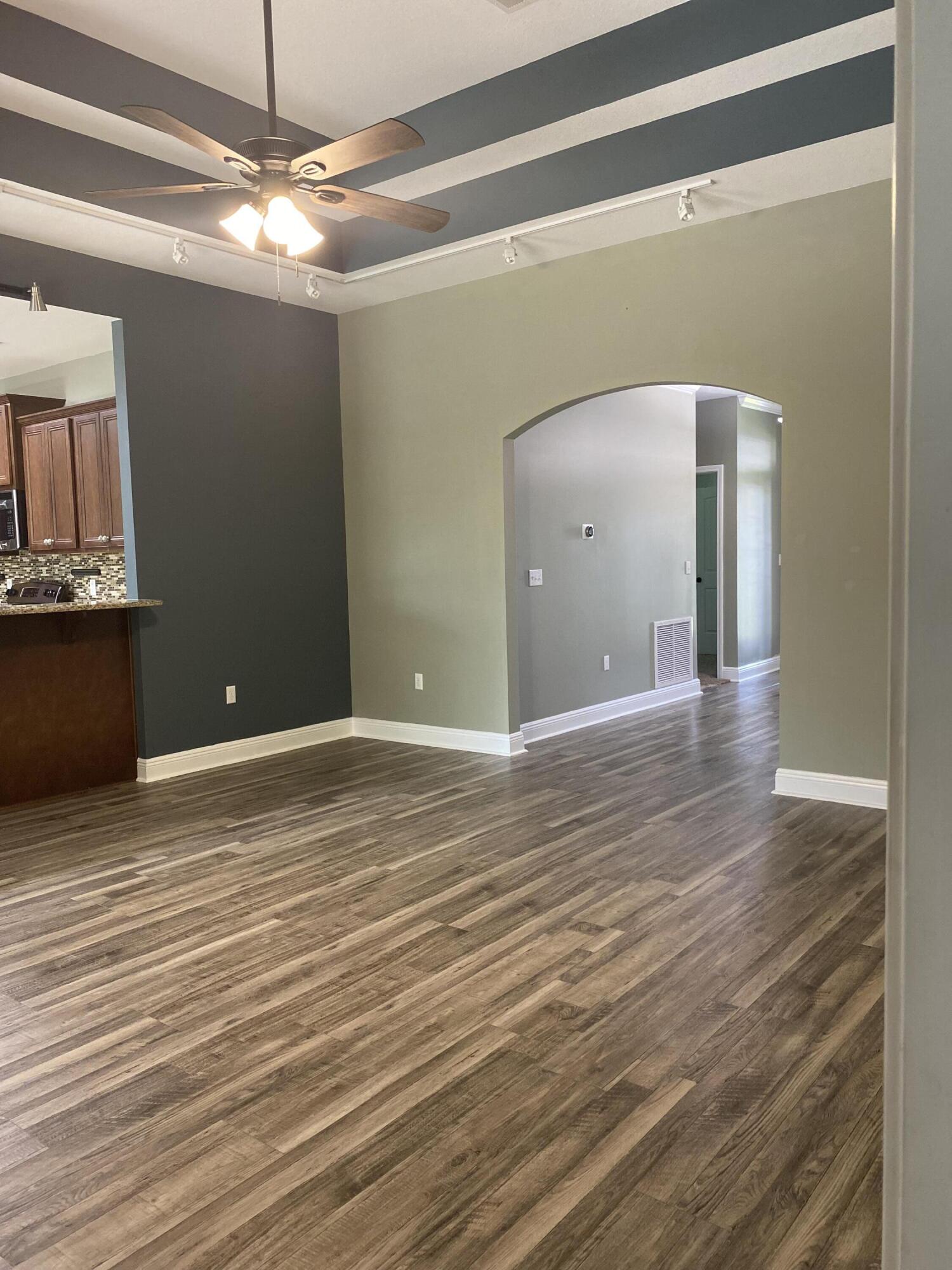 5870 Pescara Drive Pace, FL 32571 - Photo 10 of 31 a view of a livingroom with wooden floor