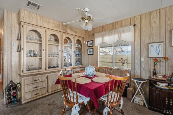 a view of a dining room with furniture window and outside view