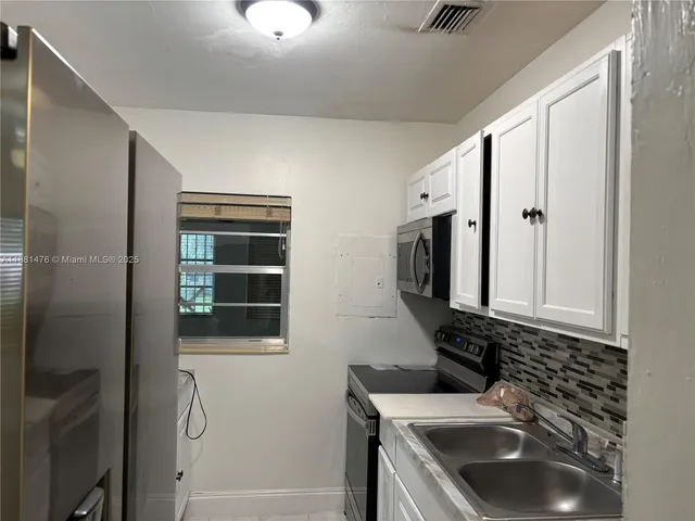 a bathroom with a sink a vanity and a mirror