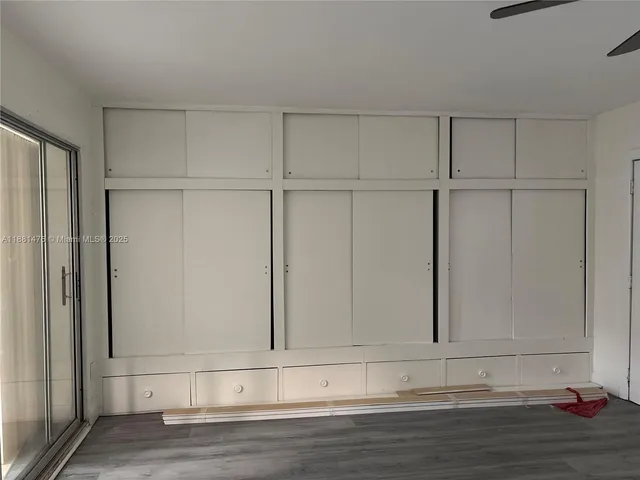 a view of a livingroom with wooden floor
