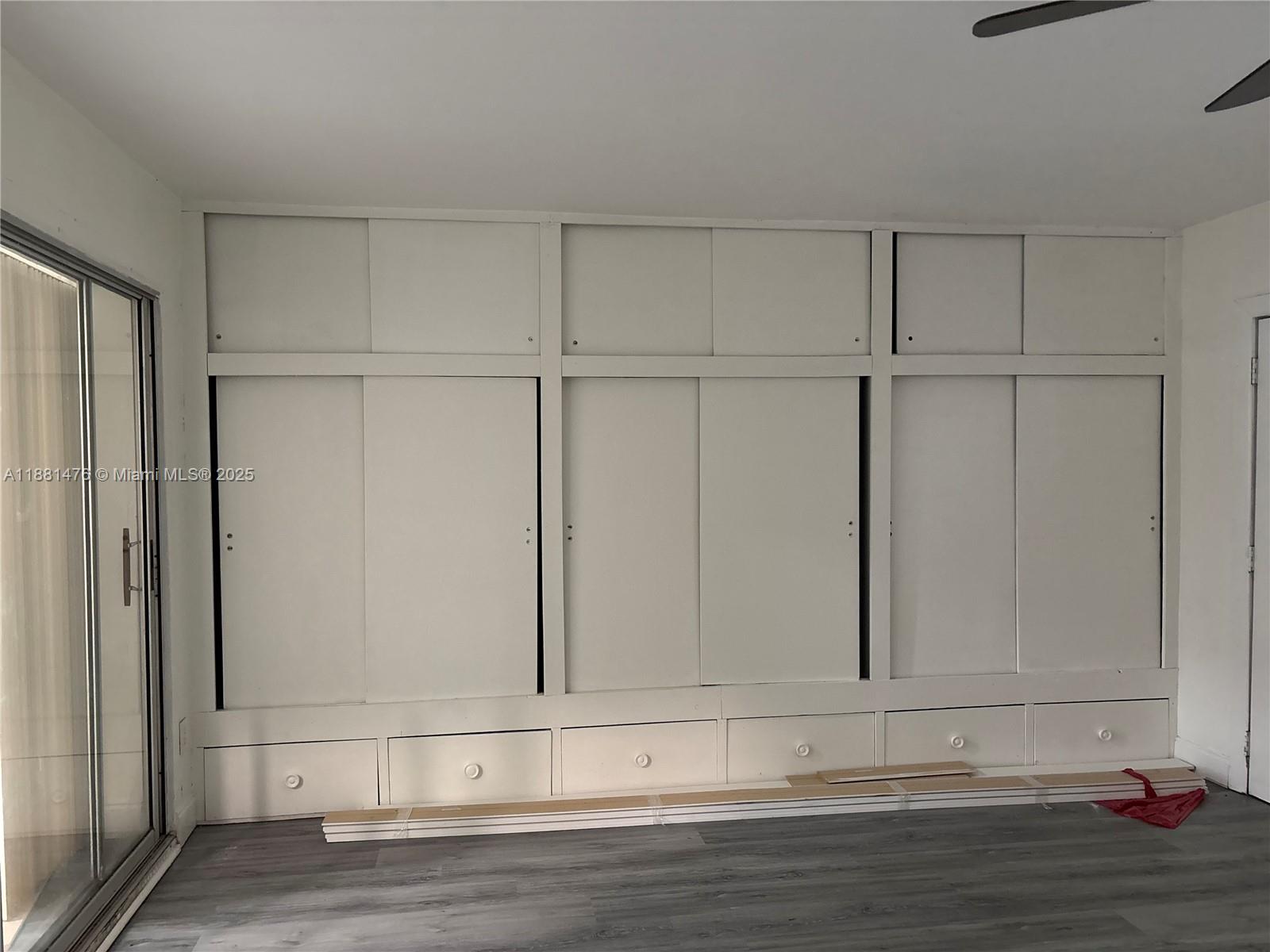 13041 Northwest 17th Court Miami, FL 33167 - Photo 20 of 23 a view of a livingroom with wooden floor