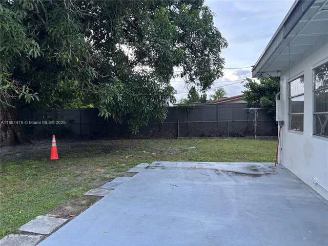 a view of backyard with green space