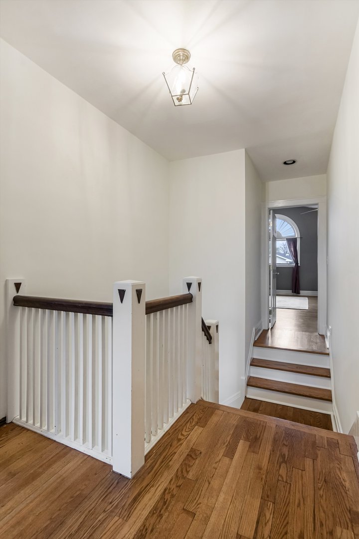 230 Wisner Street Park Ridge, IL 60068 - Photo 17 of 43 a view of a hallway with wooden floor and stairs