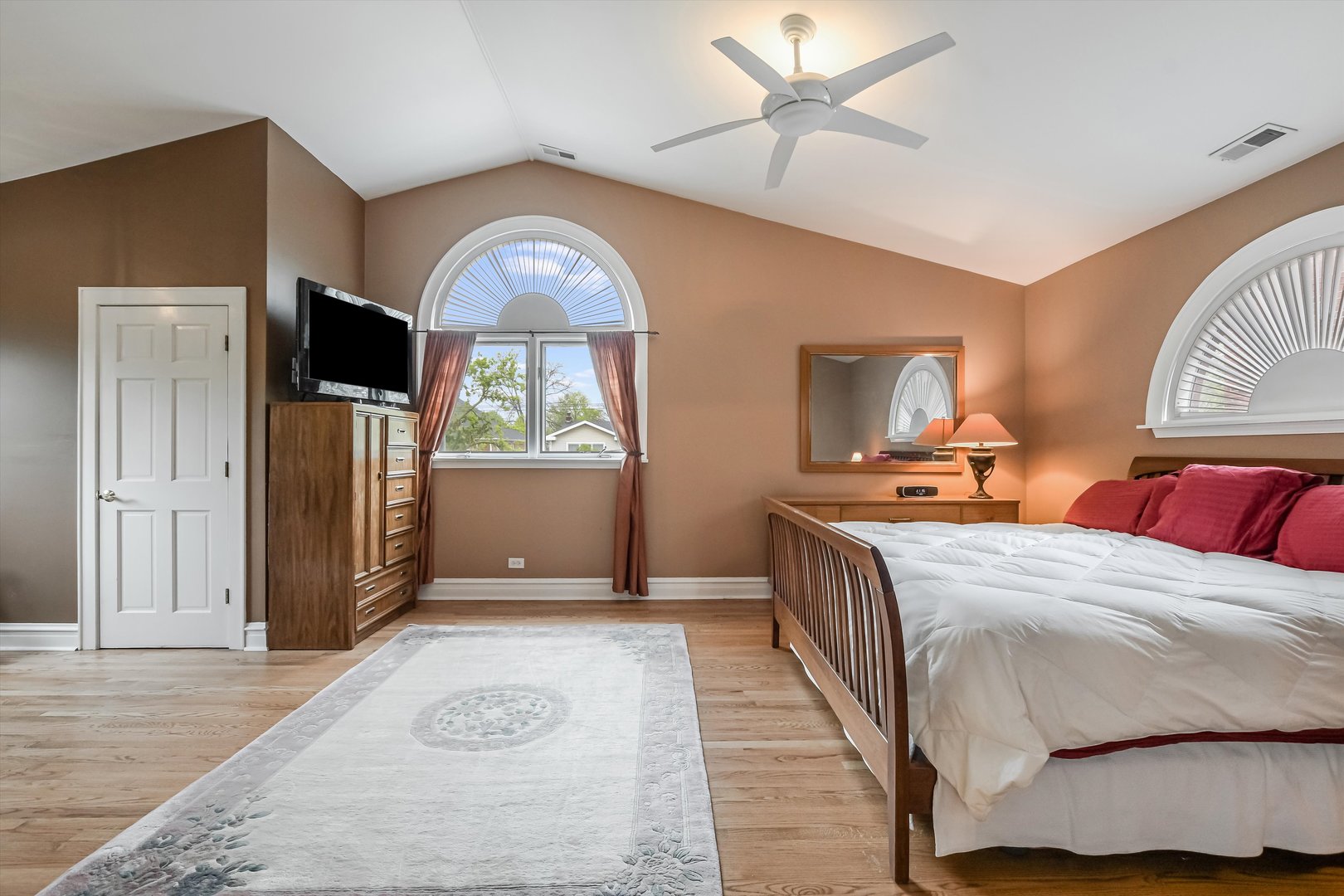 230 Wisner Street Park Ridge, IL 60068 - Photo 19 of 43 a bedroom with a large bed and a chandelier