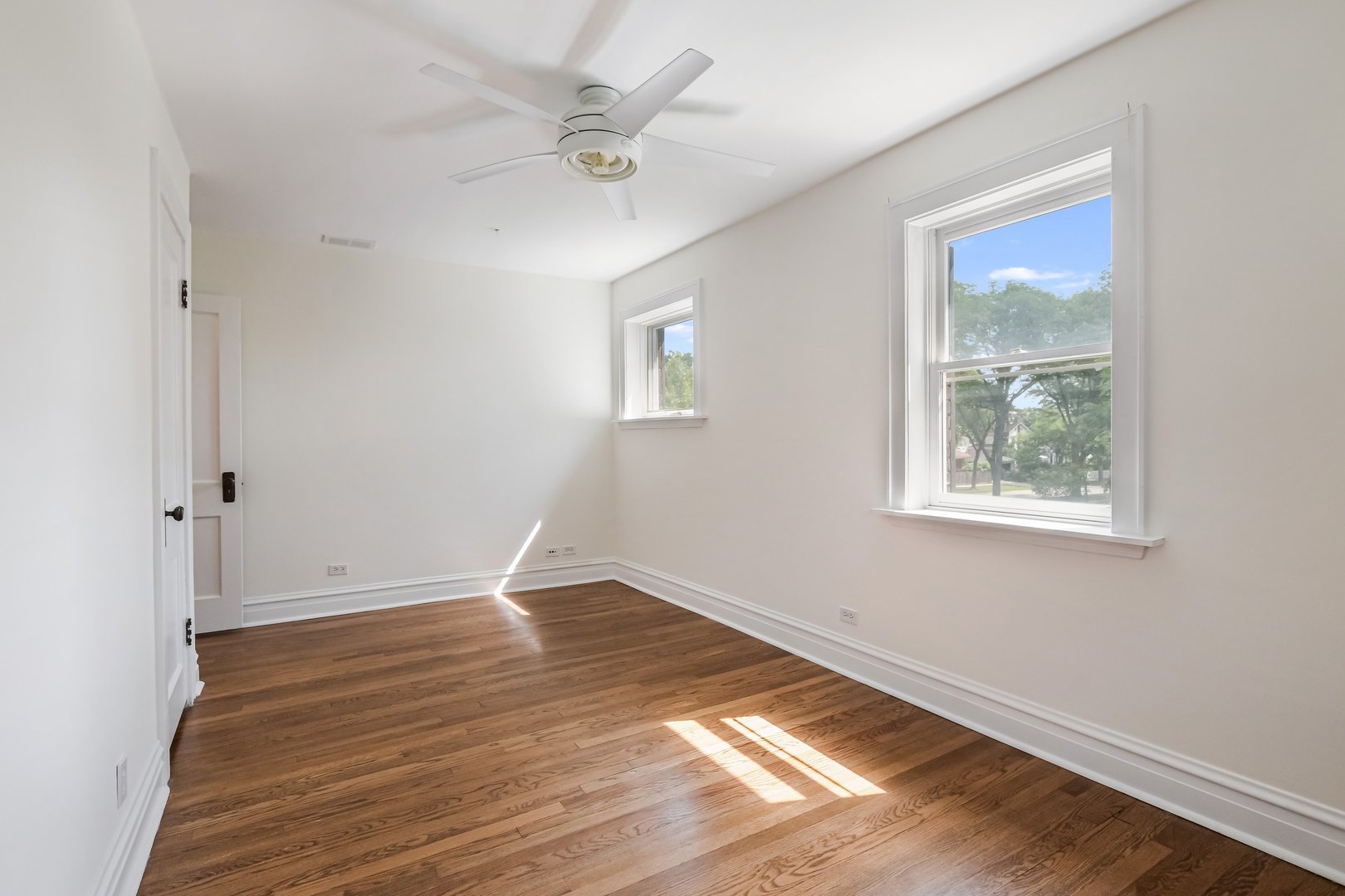 230 Wisner Street Park Ridge, IL 60068 - Photo 28 of 43 a view of an empty room with wooden floor and a window