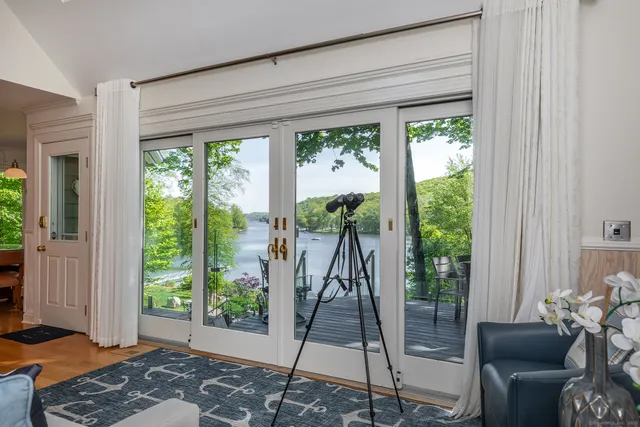 a very nice looking room with a large window and a table