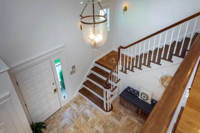 a view of stairs and hardwood floor
