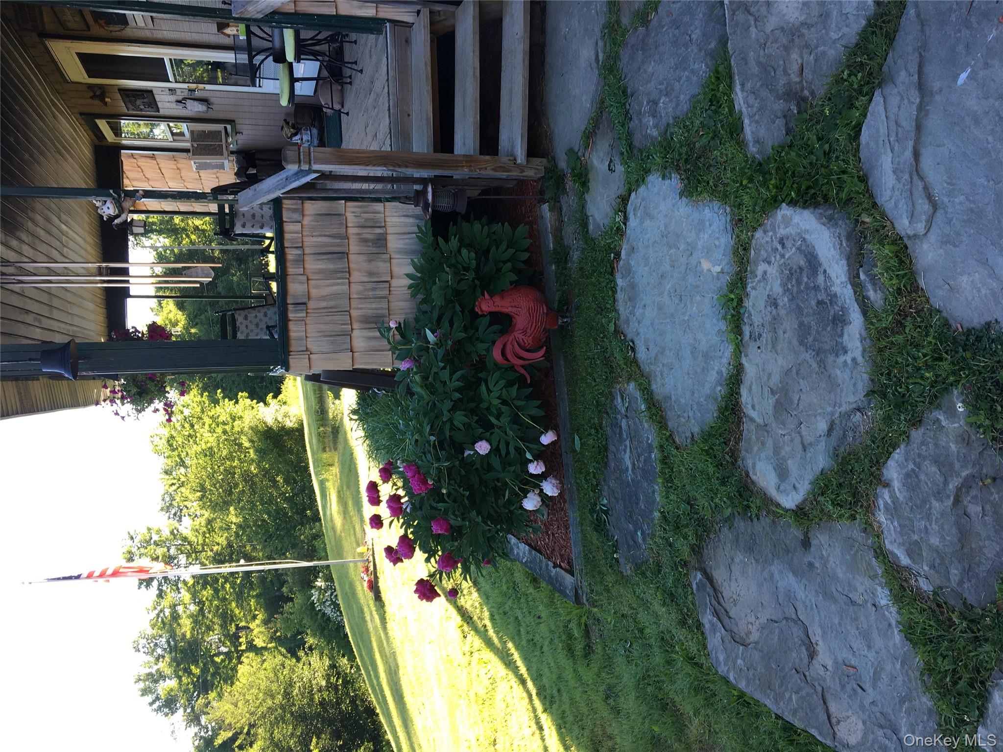 540 Lewis Road Walton, NY 13856 - Photo 15 of 40 Summer flowers against front porch