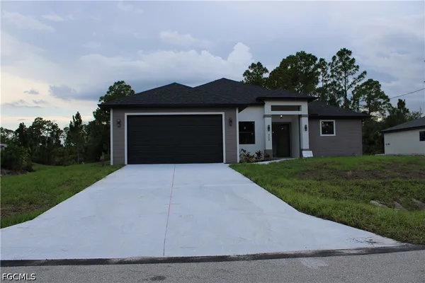$379,999 | 458 Windsor Avenue South, Lehigh Acres, FL 33974