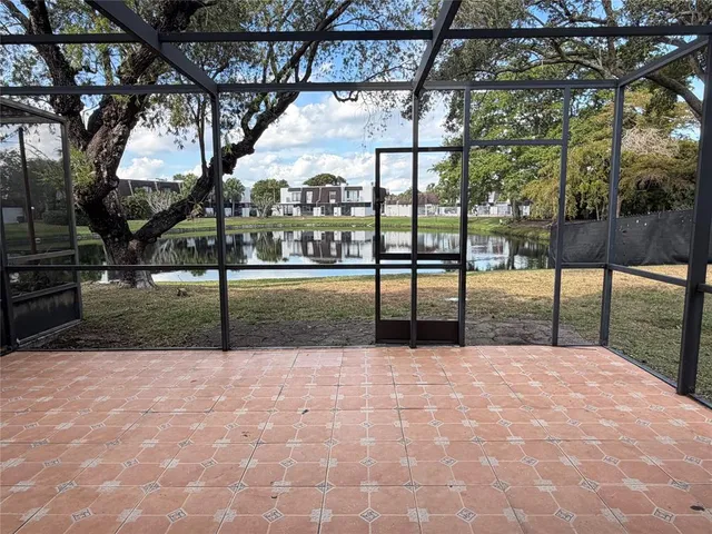 a view of a yard with a tree