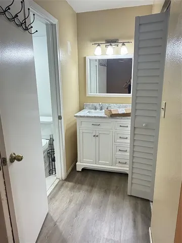 a bathroom with a double vanity sink and mirror