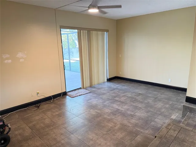 an empty room with a empty space and a window