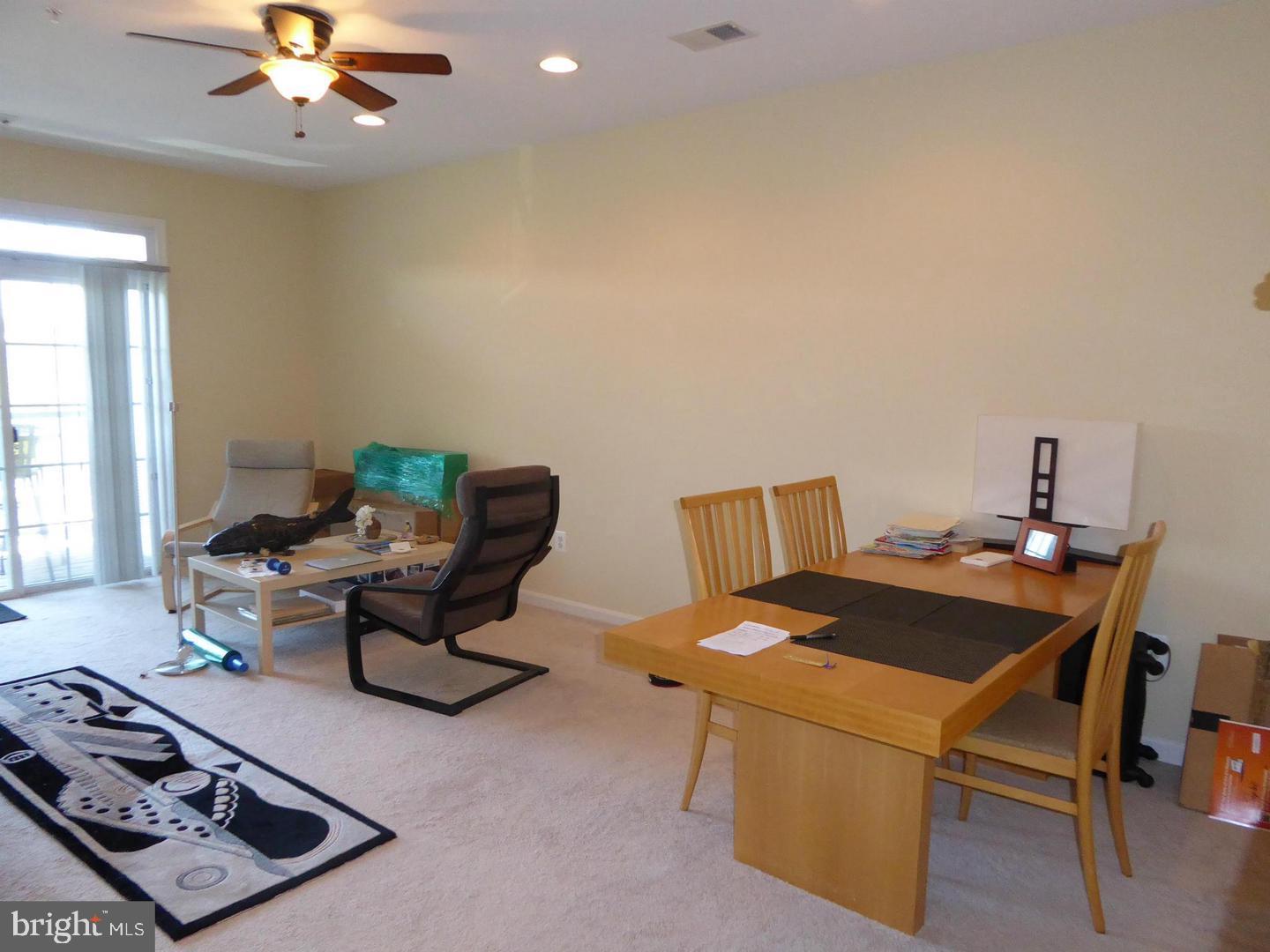21222 McFadden Square, Unit 209 Sterling, VA 20165 - Photo 6 of 16 Living Room to Patio