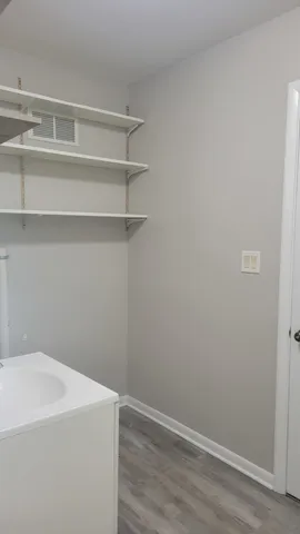 a view of small space with racks on the wall