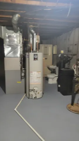 a room with water heater and racks