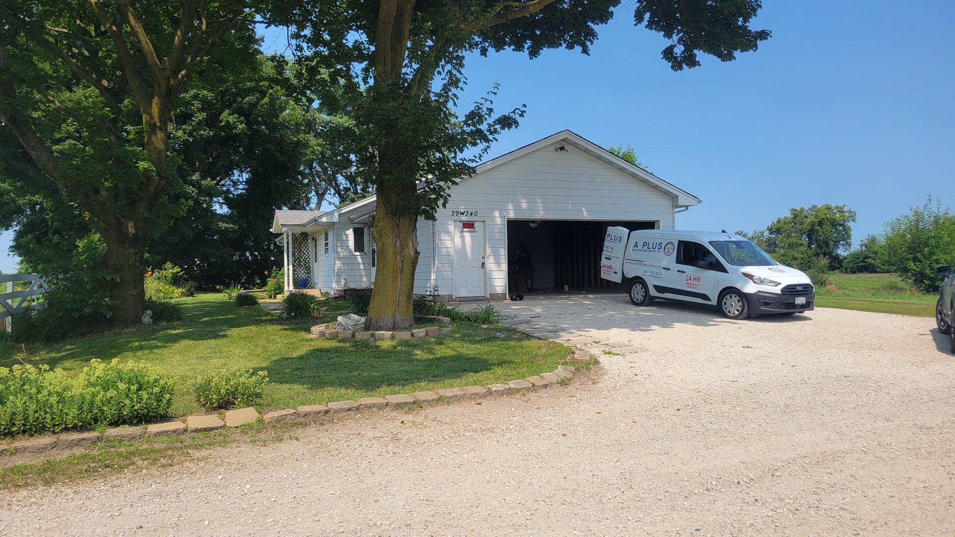 20 Highway Elgin, IL 60124 - Photo 4 of 21 a front view of a house with a yard and garage