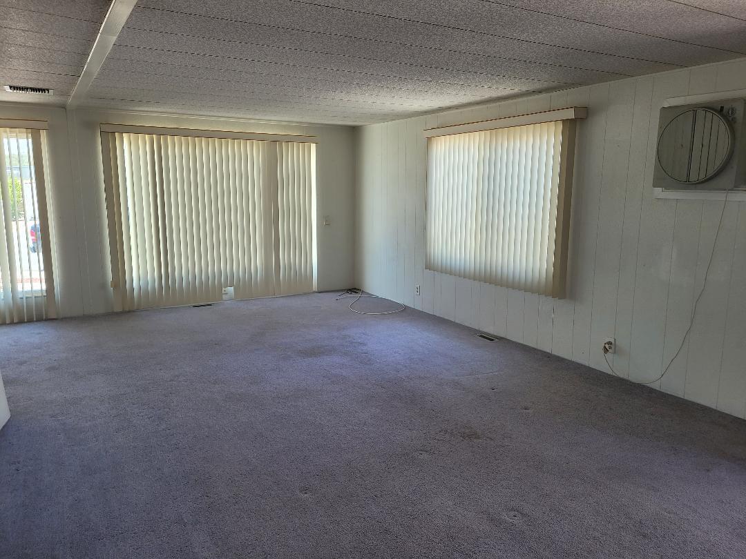 73441 Pine Valley Drive Thousand Palms, CA 92276 - Photo 3 of 12 a view of an empty room with windows