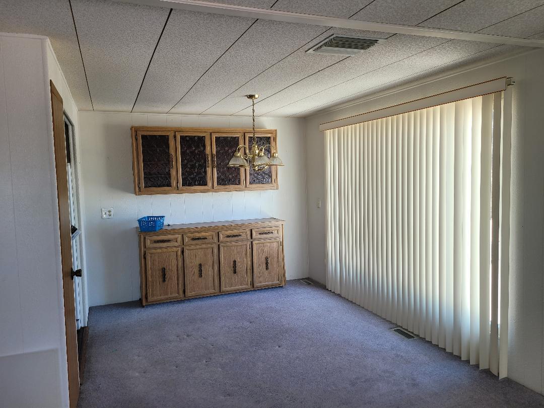 73441 Pine Valley Drive Thousand Palms, CA 92276 - Photo 4 of 12 a view of an empty room with a window