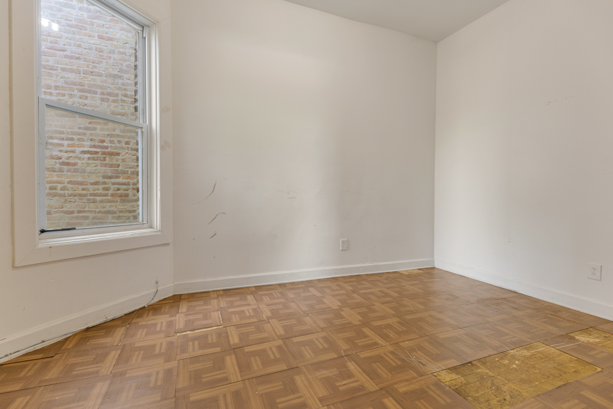 1141 South St Louis Avenue Chicago, IL 60624 - Photo 14 of 26 a view of an empty room with a window