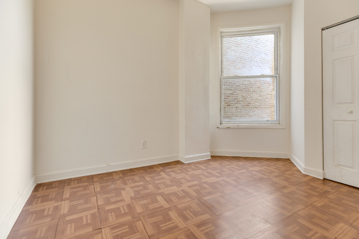 1141 South St Louis Avenue Chicago, IL 60624 - Photo 16 of 26 an empty room with a window