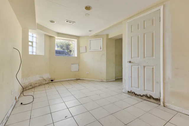 a view of an empty room with windows