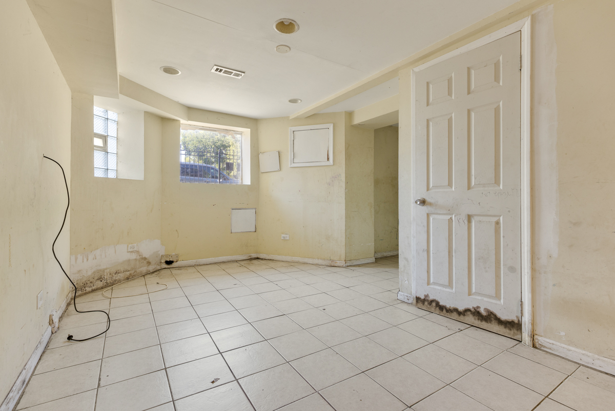 1141 South St Louis Avenue Chicago, IL 60624 - Photo 18 of 26 a view of an empty room with windows