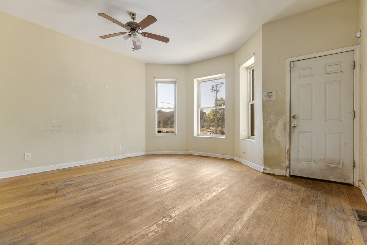 1141 South St Louis Avenue Chicago, IL 60624 - Photo 3 of 26 an empty room with fan and windows